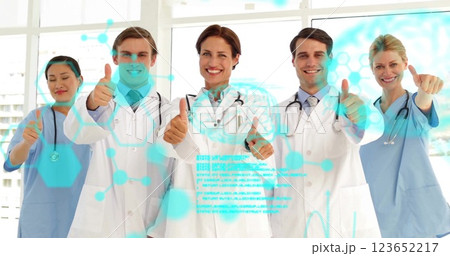 Image of data processing over diverse doctors with thumbs up 123652217