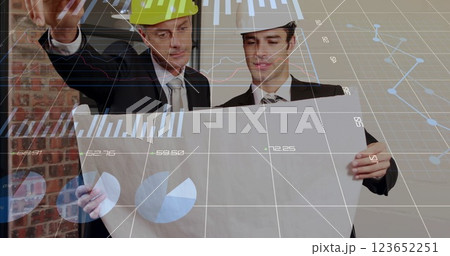 Image of financial data processing over diverse architects with plans 123652251