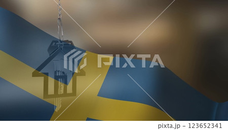 Image of silver house key over flag of sweden 123652341