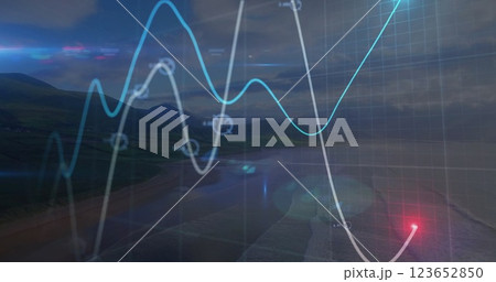 Graph with fluctuating lines and data points image over coastal landscape 123652850