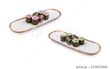 Sushi rolls presented on elegant plates with vibrant colors Sushi rolls presented on elegant plates with vibrant colors 123652909