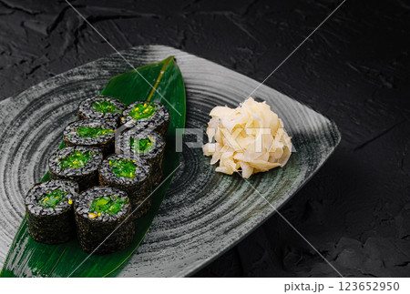Freshly prepared sushi rolls served on a decorative plate Freshly prepared sushi rolls served on a decorative plate 123652950