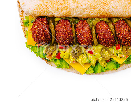 Delicious falafel sandwich with fresh toppings and vibrant colors Delicious falafel sandwich with fresh toppings and vibrant colors 123653236