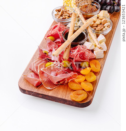 Charcuterie board with assorted meats and snacks for a gathering 123653421