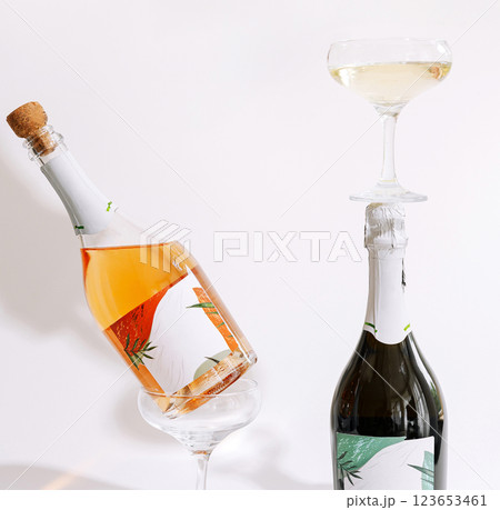 Balancing champagne bottles with elegant glassware on display 123653461