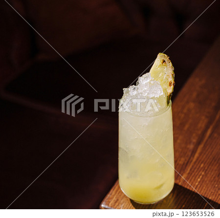 Refreshing cocktail with crushed ice and fruit garnish Refreshing cocktail with crushed ice and fruit garnish 123653526
