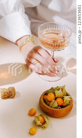 Elegant gathering with sparkling drink and fresh fruit on table 123653681