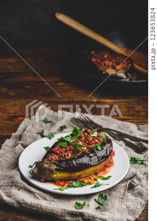 Eggplant stuffed with ground beef and tomatoes 123653824