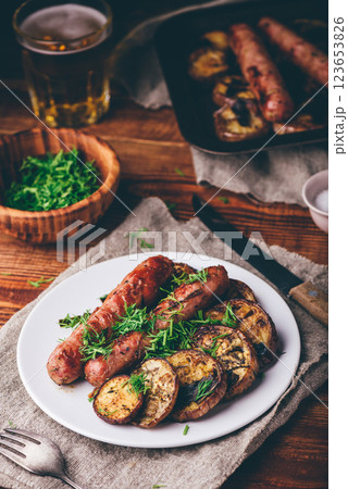 Baked Pork Sausages with Slices of Eggplant 123653826