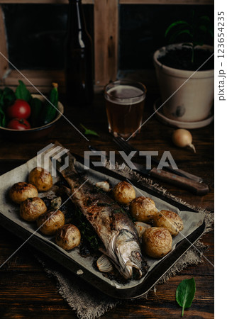Baked Sea Bass Stuffed with Sorrel on Baking Tray 123654235