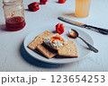 Hot Pepper Jam with Cream Cheese on Crackers 123654253
