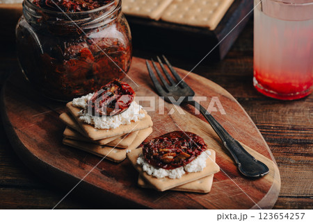 Crackers with homemade sundried tomato and cream cheese 123654257