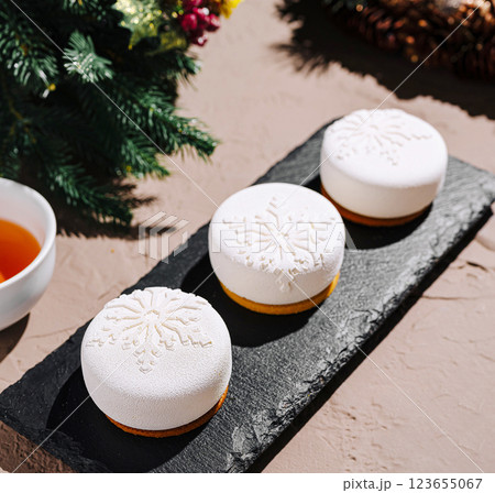 Festive dessert display with snowflake decorations on a platter 123655067