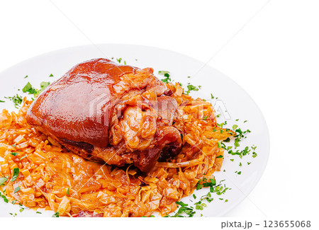 Savory pork knuckle served on a plate with seasoned cabbage 123655068