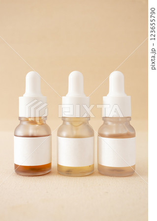 Set of facial serum in bottles minimalist cosmetics skincare beauty product, vertical Set of facial serum in bottles minimalist cosmetics skincare beauty product, vertical 123655790