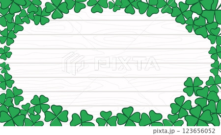 St. Patrick s Day Frame with copy space. Green leaves on white wooden texture backdrop. Shamrock and clover template, banner, background 123656052