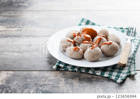 Papas arrugadas with mojo on wooden table. Traditional Canary Islands food. 123656994