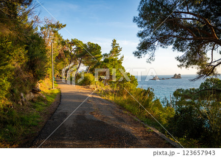 Pedestrian path to tunnel through a rock or mountain near Petrovac town in winter time, Montenegro.  123657943
