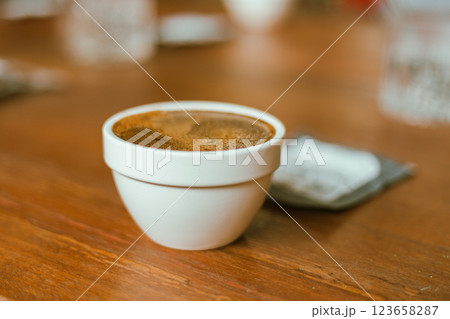 Barista preparing to test and inspecting the quality of coffee Barista preparing to test and inspecting the quality of coffee 123658287