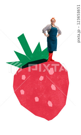Female gardener standing proudly on gigantic strawberry with hands on hips, wearing red boots and plaid shirt. Playful farming collage. Female gardener standing proudly on gigantic strawberry with hands on hips, wearing red boots and plaid shirt. Playful farming collage. 123658651