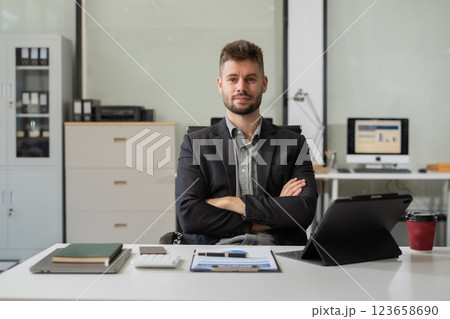 successful businessman male with inspiration from their excellent financial results. successful businessman male with inspiration from their excellent financial results. 123658690