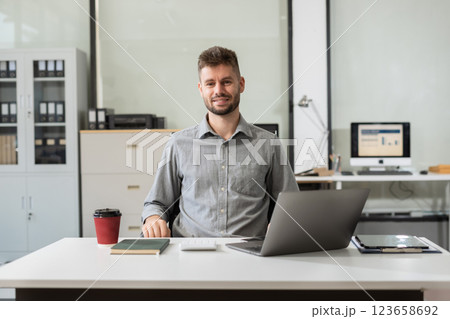 successful businessman male with inspiration from their excellent financial results. 123658692