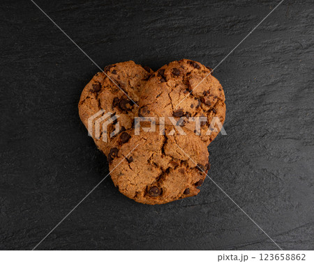 Chocolate chips pile cookies , American biscuits, cocoa confectionery cake, sweet morsels bakery Chocolate chips pile cookies , American biscuits, cocoa confectionery cake, sweet morsels bakery 123658862