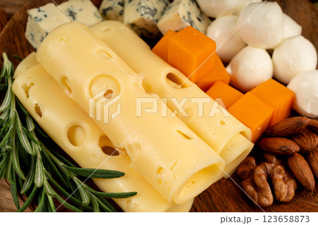 Cheese plate of color cheeses variety, yellow, white and blue cheese board, assorted dairy products 123658873