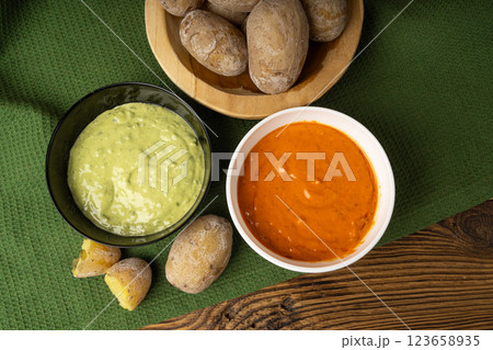 Red mojo rojo and green mojo verde sauces, traditional Tenerife dips, mojo picon dressing 123658935