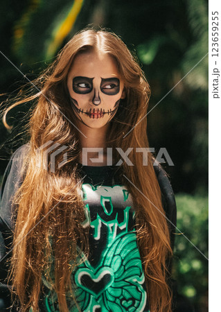 Portrait of creepy teenage girl with Halloween makeup 123659255