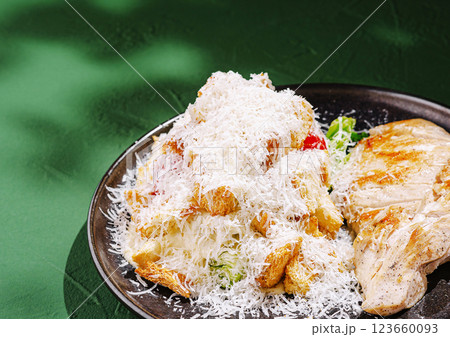Grilled chicken with fresh salad and cheese on a green table Grilled chicken with fresh salad and cheese on a green table 123660093