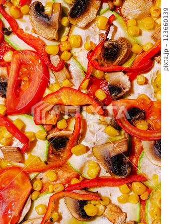 Colorful vegetable pizza topped with fresh ingredients 123660139