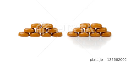 Caramel candies isolated, toffee caramel, round hard milk confectionery, brown sugar candies, small sweets 123662002