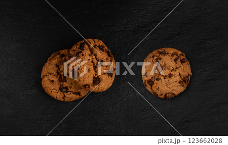 Chocolate chips pile cookies , American biscuits, cocoa confectionery cake, sweet morsels bakery Chocolate chips pile cookies , American biscuits, cocoa confectionery cake, sweet morsels bakery 123662028