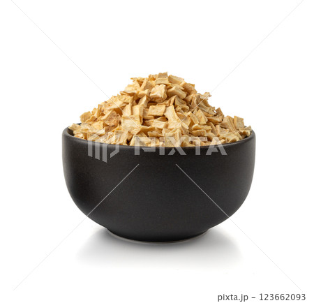 Dry parsley root, dried diced celery cubes, scattered small liquorice pileces, dry vegetable 123662093