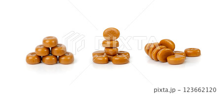 Caramel candies isolated, toffee caramel, round hard milk confectionery, brown sugar candies, small sweets 123662120