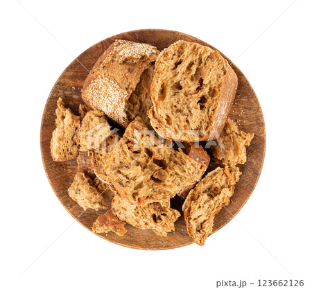 Broken wheat brown bread pieces isolated, fitness pumpkin carrot buns with seeds, cereal bread 123662126