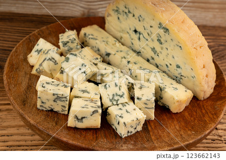 Fourme cheese, stinky french cheese, Fourme d'Ambert gourmet food, semi-hard blue cheese 123662143