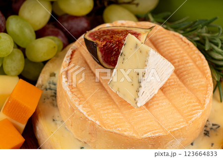 Cheese plate of color cheeses variety, yellow, white and blue cheese board, assorted dairy products 123664833
