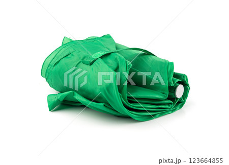 Compact folded umbrella isolated, small green parasol, old umbrella 123664855