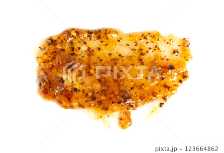 Orange jam with chili isolated, apricot chilli pepper marmalade smear, spicy fruit jelly fruity confiture 123664862