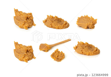 Miso paste isolated. Japanese shiro miso seasoning sauce, fermented soybean spread, brown soy cream Miso paste isolated. Japanese shiro miso seasoning sauce, fermented soybean spread, brown soy cream 123664999