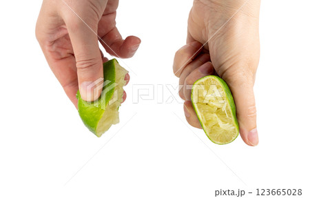 Squeezed lime isolated, squeezed out half green lemon on white background, burnout symbol 123665028
