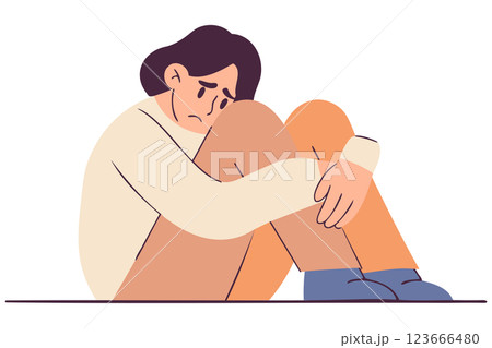 Sad guy sitting alone in depression, mental health, introspective moment, vulnerable pose 123666480