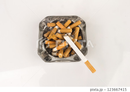 Ashtray butts cigarette on white Ashtray butts cigarette on white 123667415