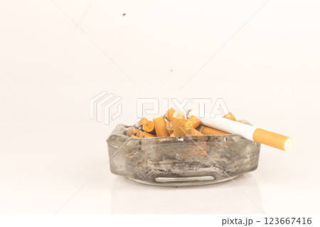 Ashtray butts cigarette on white 123667416