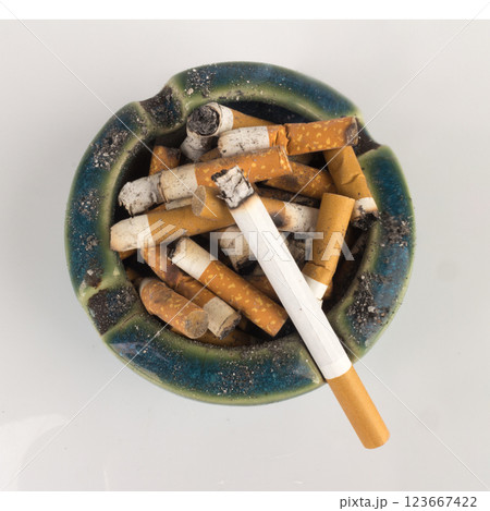 Ashtray butts cigarette on white 123667422