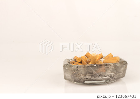 Ashtray butts cigarette on white Ashtray butts cigarette on white 123667433