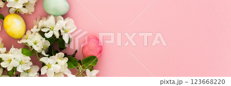 Easter eggs and blooming apple tree branches 123668220