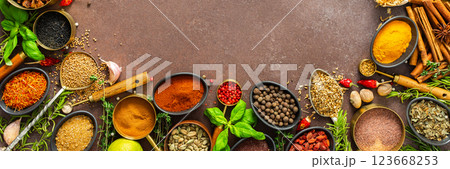 A visually striking arrangement of fresh spices and herbs on a brown surface, highlighting their vivid colors, intricate details, and rich culinary essence, banner A visually striking arrangement of fresh spices and herbs on a brown surface, highlighting their vivid colors, intricate details, and rich culinary essence, banner 123668253